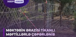 Məktəbin ərazisi tikanli məftillərlə çəpərlənib - VİDEO