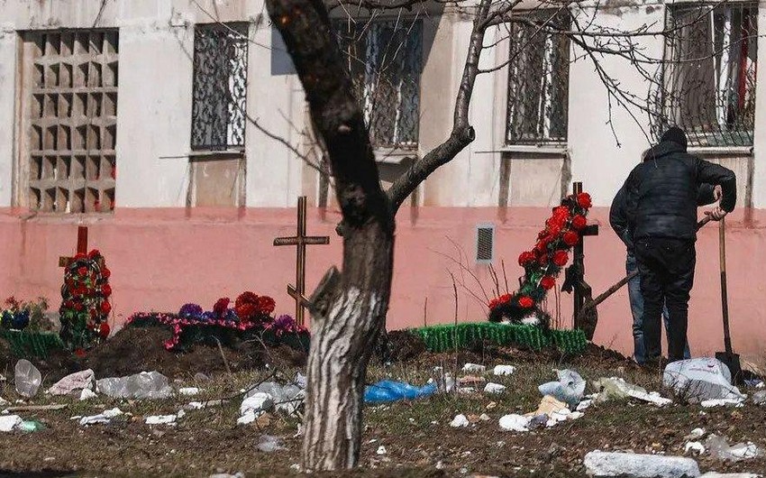 "Mariupolda kimliyi müəyyən edilməyən meyitlər tullantılarla birgə poliqona aparılır"