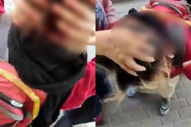 İranda əxlaq polisi etiraz edən qadının başını yardı - VİDEO